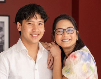 A woman and a man smiling at the camera