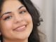 close up of a woman smiling at the camera